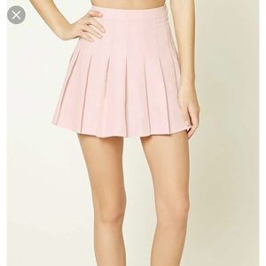 Pink pleated mini skirt